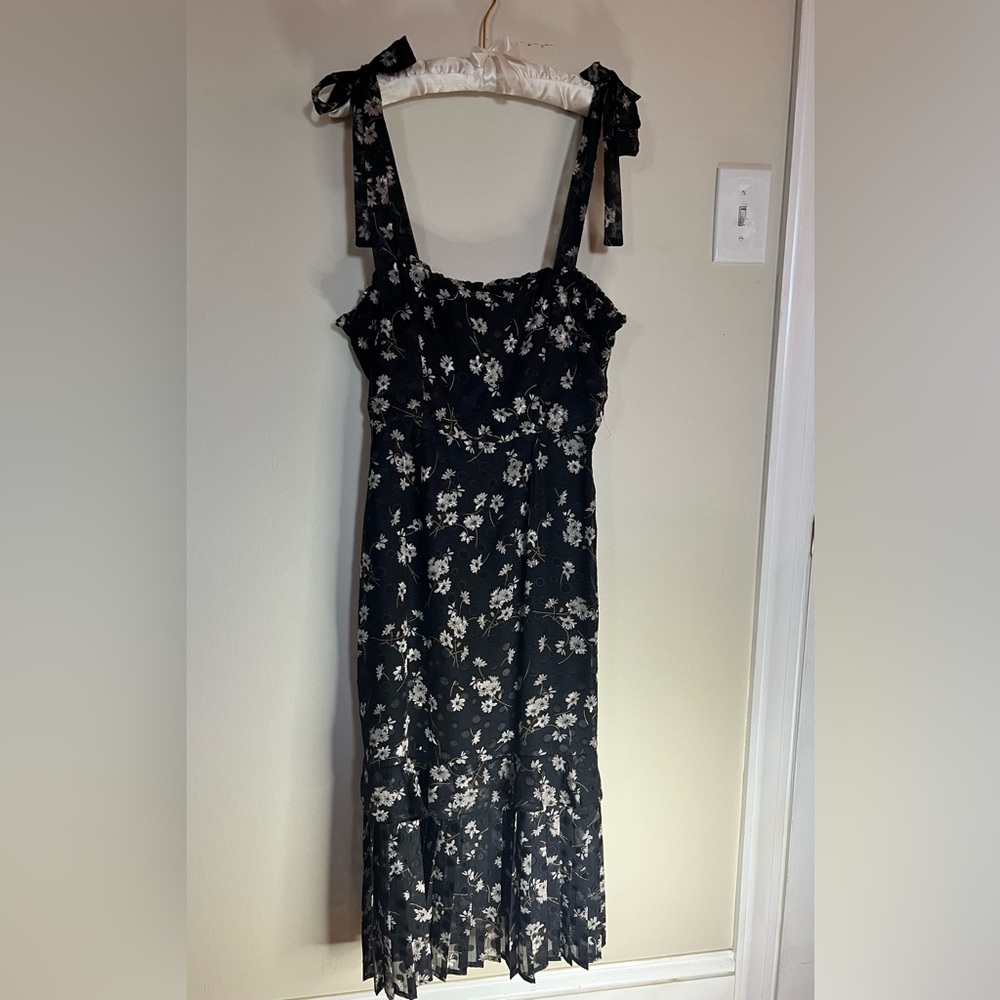 Lulu’s black and white floral midi dress with flair bottom.